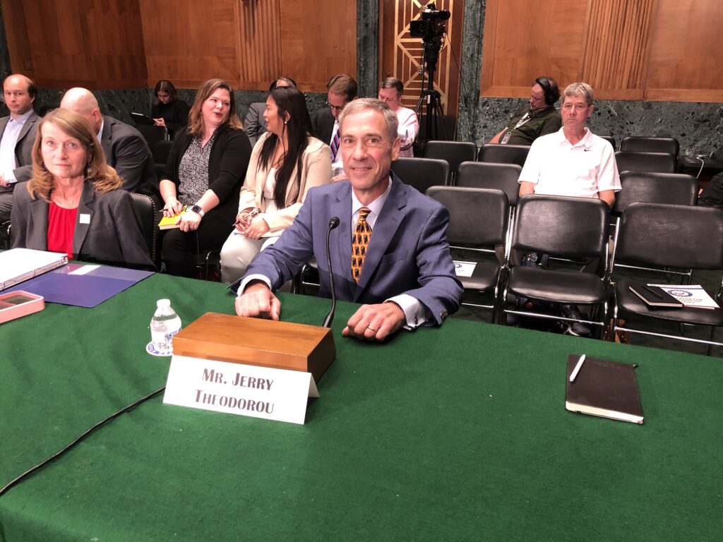 Jerry Theodorou testifying at a Senate banking committee hearing.